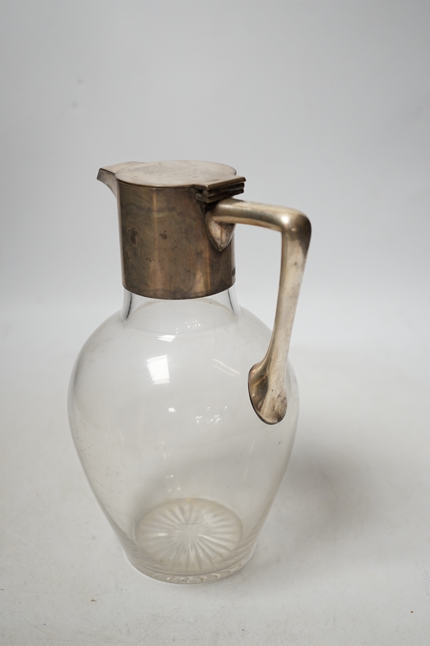 A Hukin & Heath claret jug, in the manner of Christopher Dresser, 20cm high